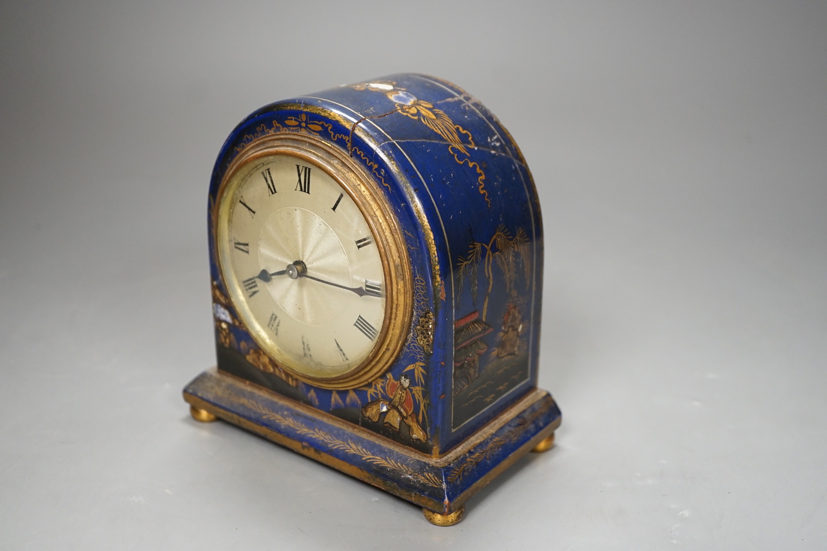 A small Chinoiserie lacquer cased mantle timepiece, (with damage) 14cm tall